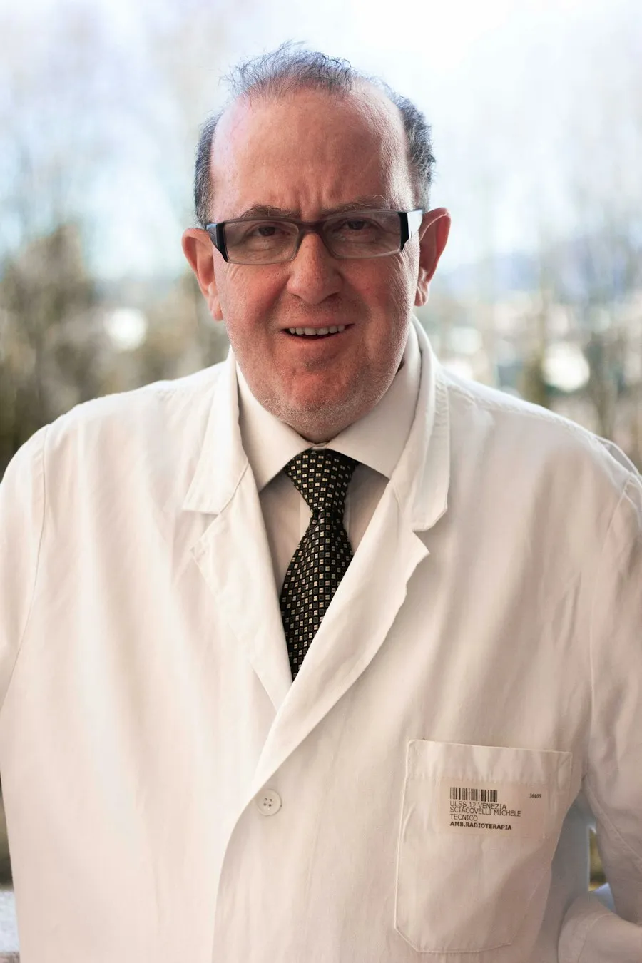 Dr. Richard Hale, an older doctor with glasses, in a white coat and tie